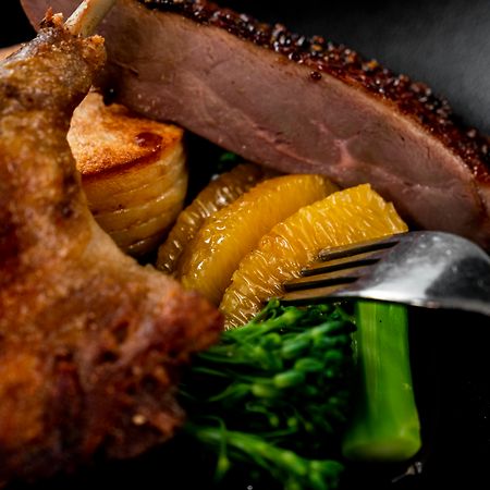 The Point Brisbane Hotel Zewnętrze zdjęcie A duck confit with orange and vegetables
