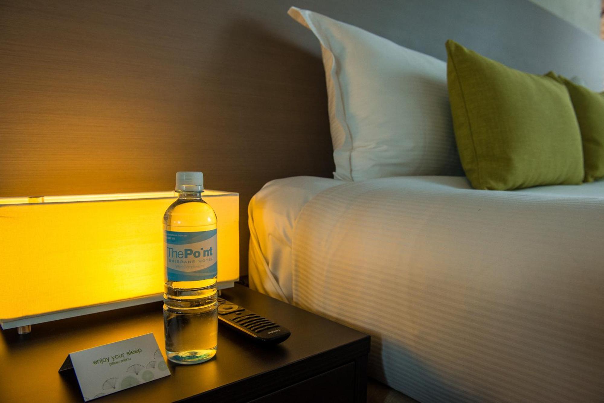 The Point Brisbane Hotel Zewnętrze zdjęcie A bottle of water on a bedside table